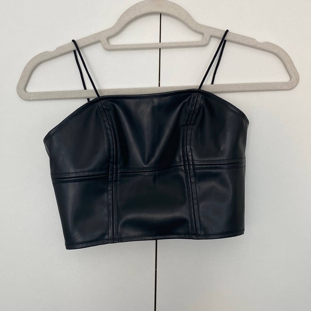 Faux leather bustier top with exposed zipper. Size XS. Never worn.